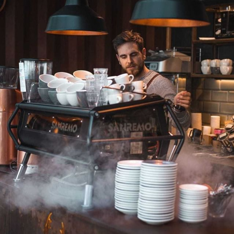 Cafe Racer | Photo of Barista Using Steam Wand